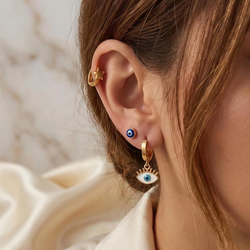 طقم ٣ أزواج حلقان ذهبي مميز: بريمة العين الزرقاء، النجمة الذهبية، وعين الرموش البيضاء. من الستانلس ستيل المقاوم للصدأ، تشكيلة تجمع بين الرقة والفخامة. - Image 3